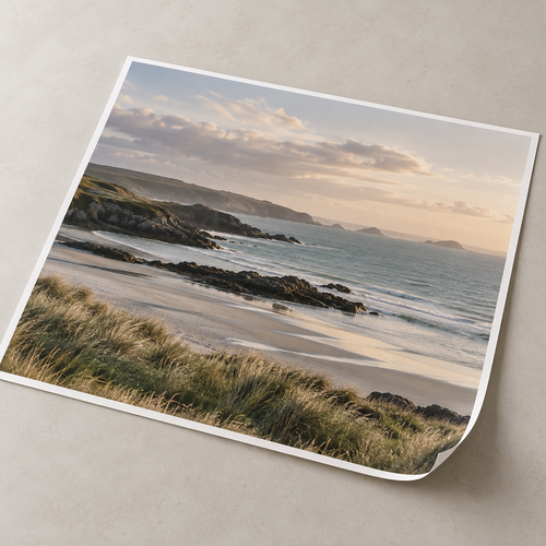 Illustrative enlarged photographic print showing a coastal landscape.